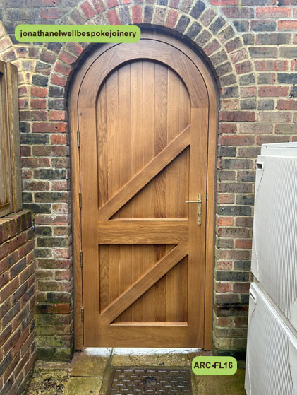 arched door framed ledged and braced oak